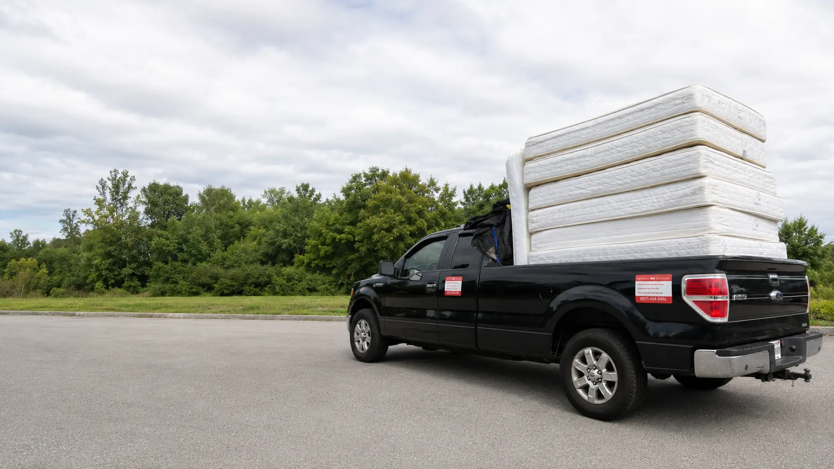 Mattress Pro Recycling truck loaded with mattresses for curbside pickup